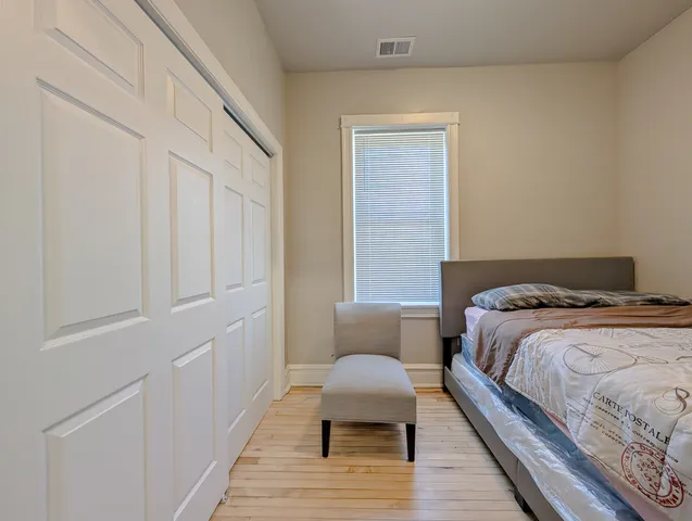 a bedroom with a bed and a table