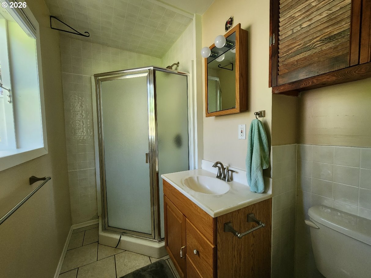 92504 Paradise Point Road Port Orford, OR 97465 - Photo 17 of 39 a bathroom with a sink and a mirror