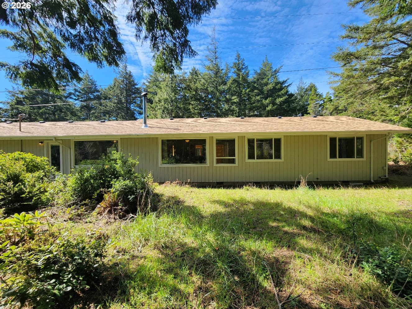 92504 Paradise Point Road Port Orford, OR 97465 - Photo 30 of 39 a view of a house with a yard