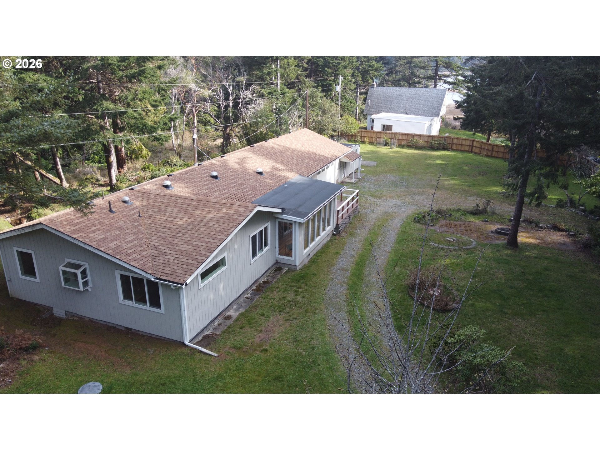 92504 Paradise Point Road Port Orford, OR 97465 - Photo 37 of 39 a aerial view of a house with a yard
