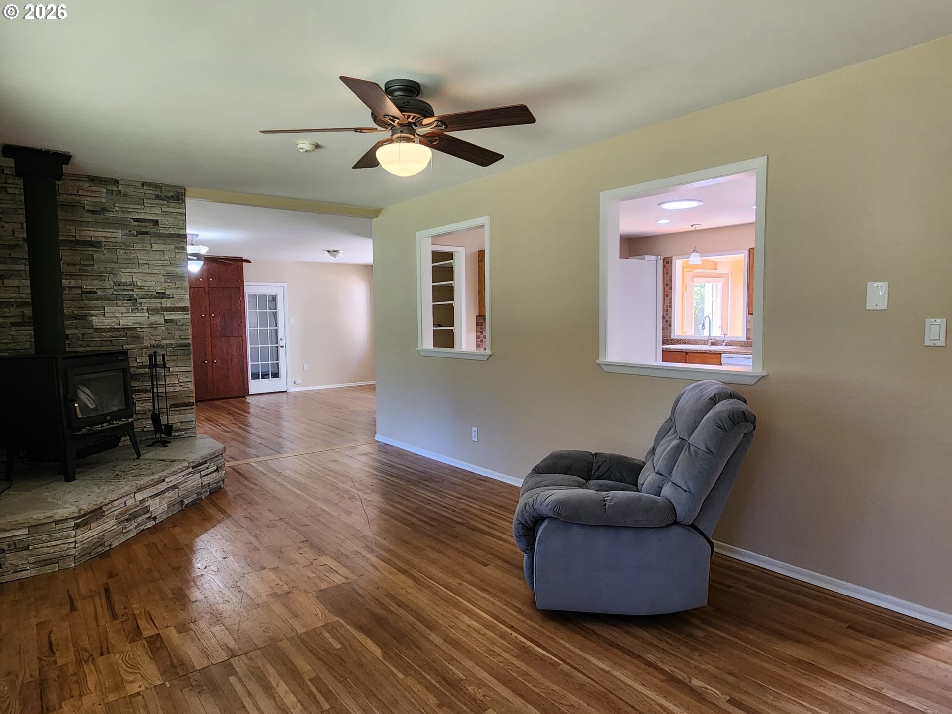 92504 Paradise Point Road Port Orford, OR 97465 - Photo 9 of 39 a living room with furniture and a fireplace