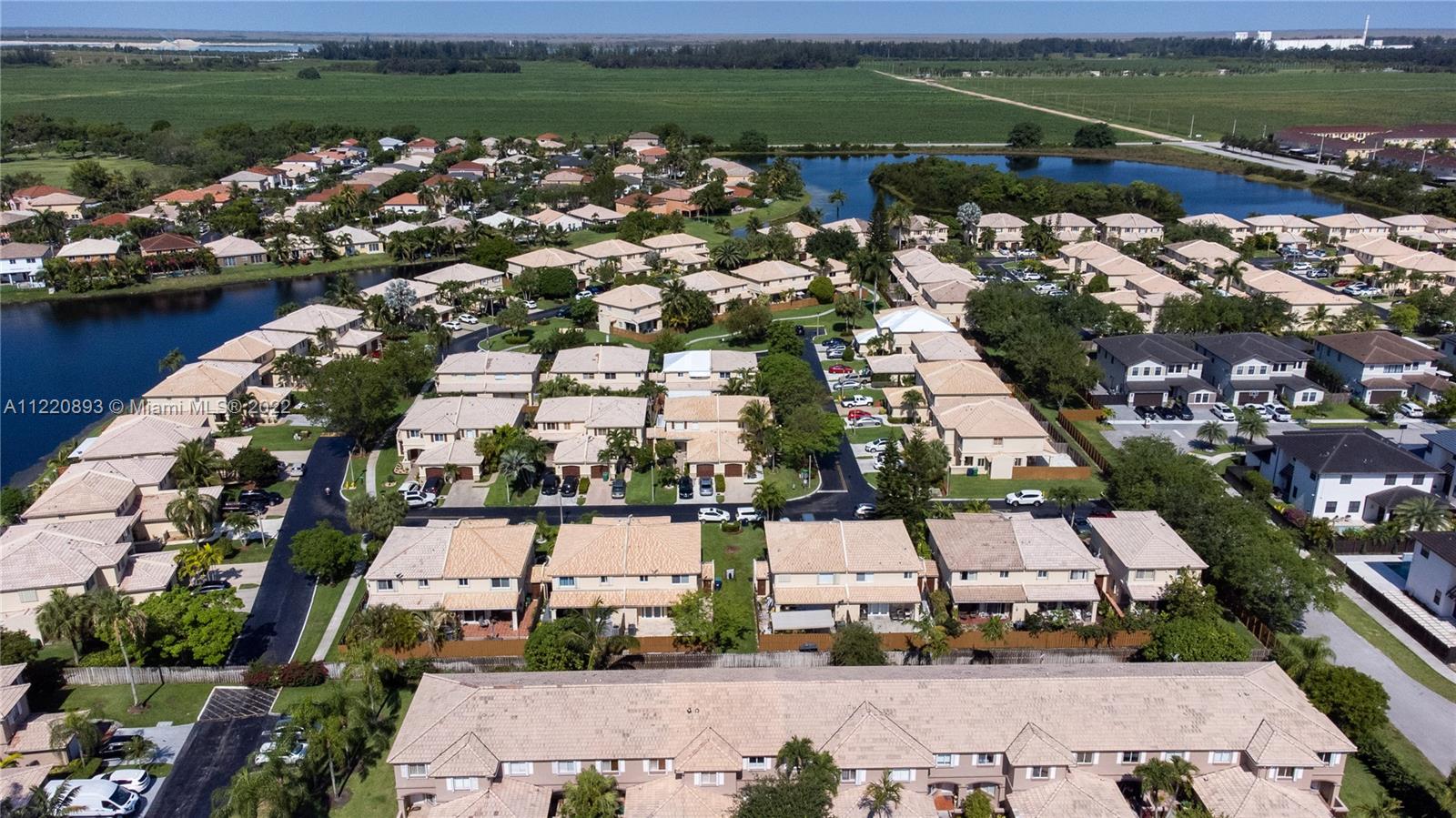 West Kendall Miami, FL 33193 - Photo 28 of 33 an aerial view of a city with lots of residential buildings lake and ocean view