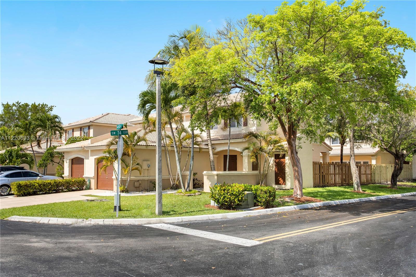 West Kendall Miami, FL 33193 - Photo 3 of 33 a view of brick house with a big yard and large trees