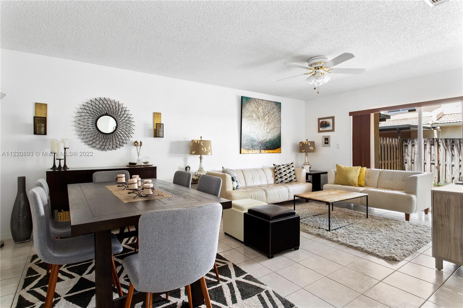 West Kendall Miami, FL 33193 - Photo 5 of 33 a living room with furniture a large window and a table