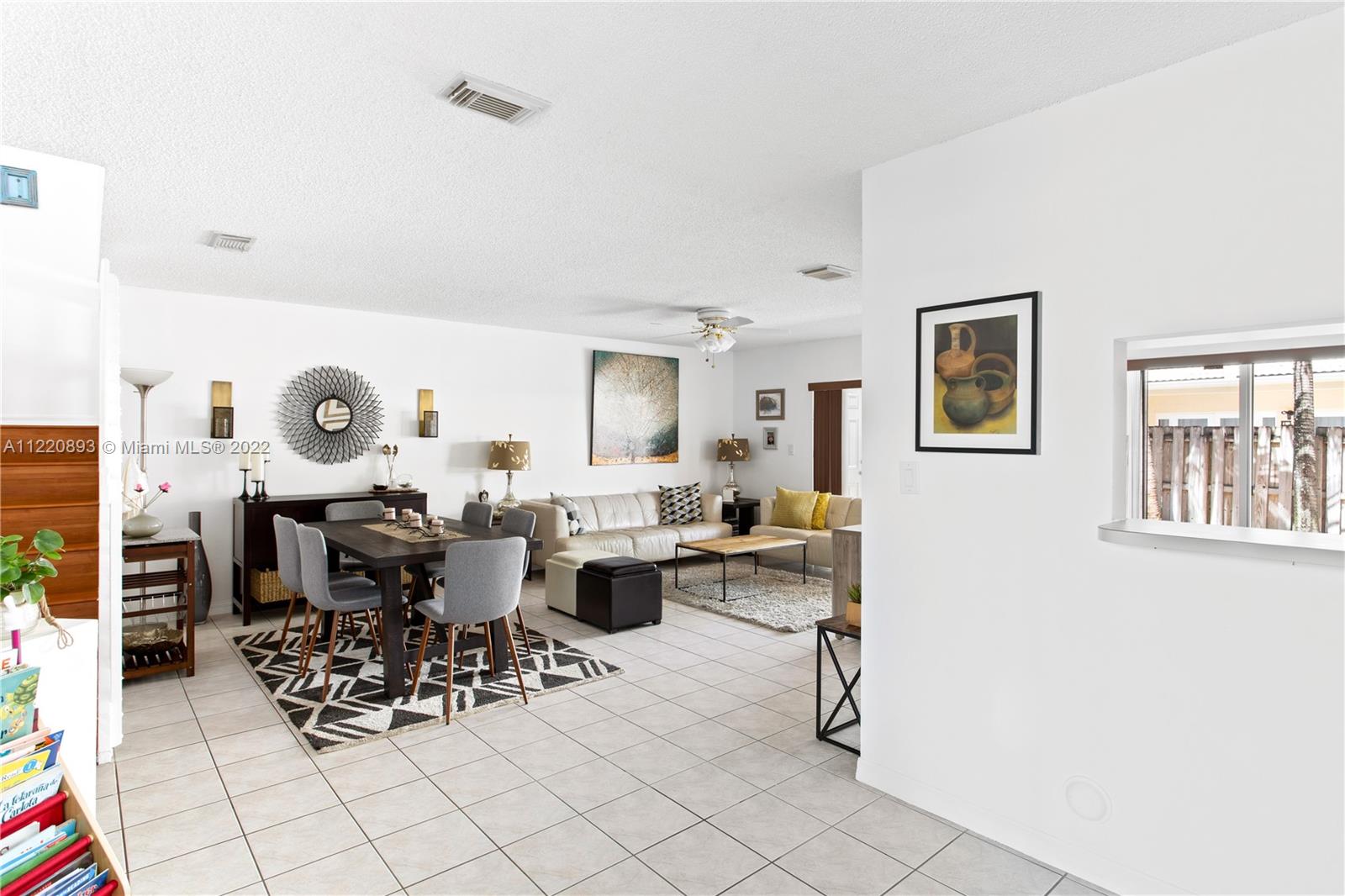West Kendall Miami, FL 33193 - Photo 7 of 33 a living room with lots of furniture and view of kitchen