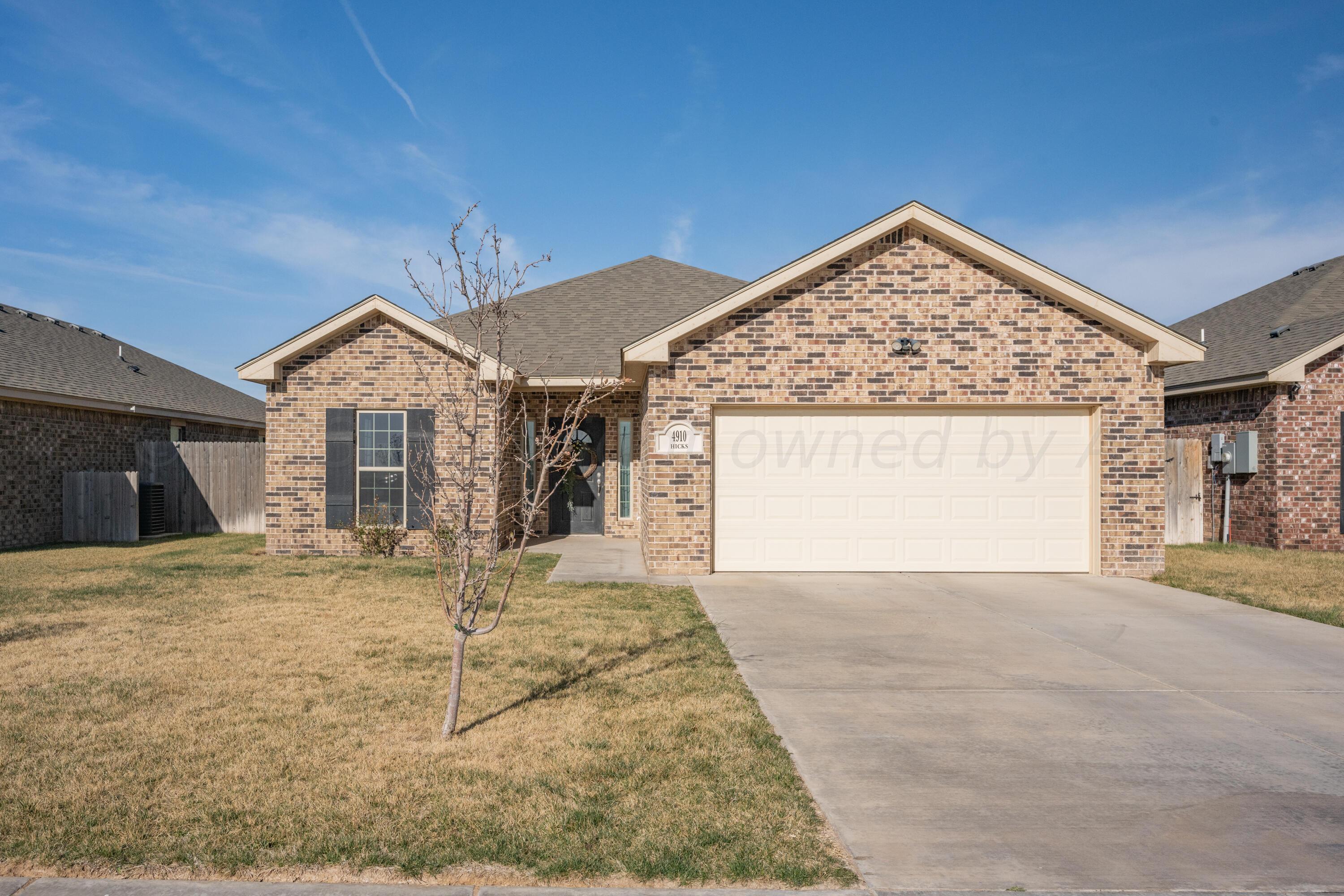 4910 Hicks Street Amarillo, TX 79118 - Photo 1 of 19 a view of a house with a garage and window