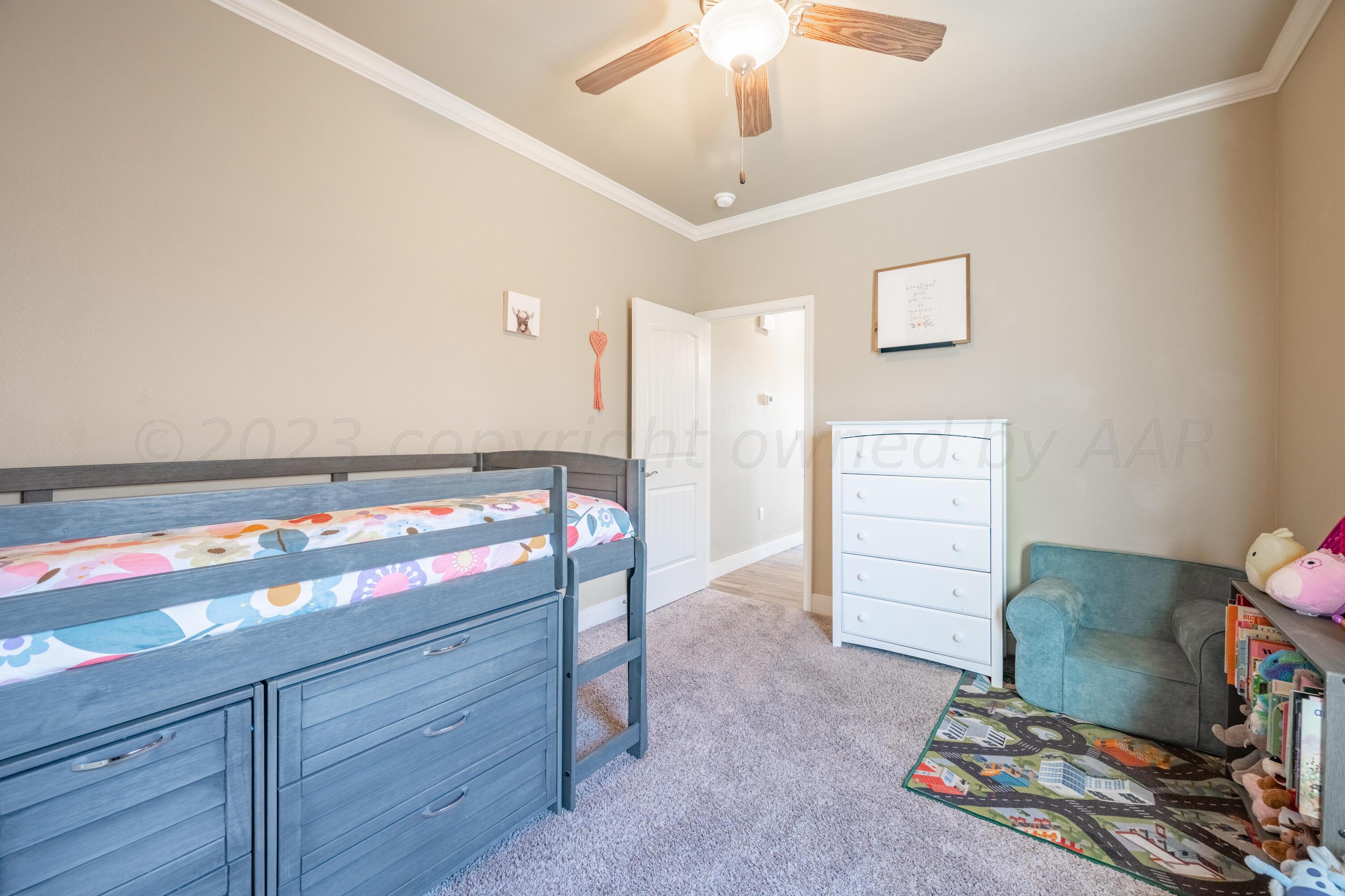 4910 Hicks Street Amarillo, TX 79118 - Photo 13 of 19 a view of room with furniture and wooden floor