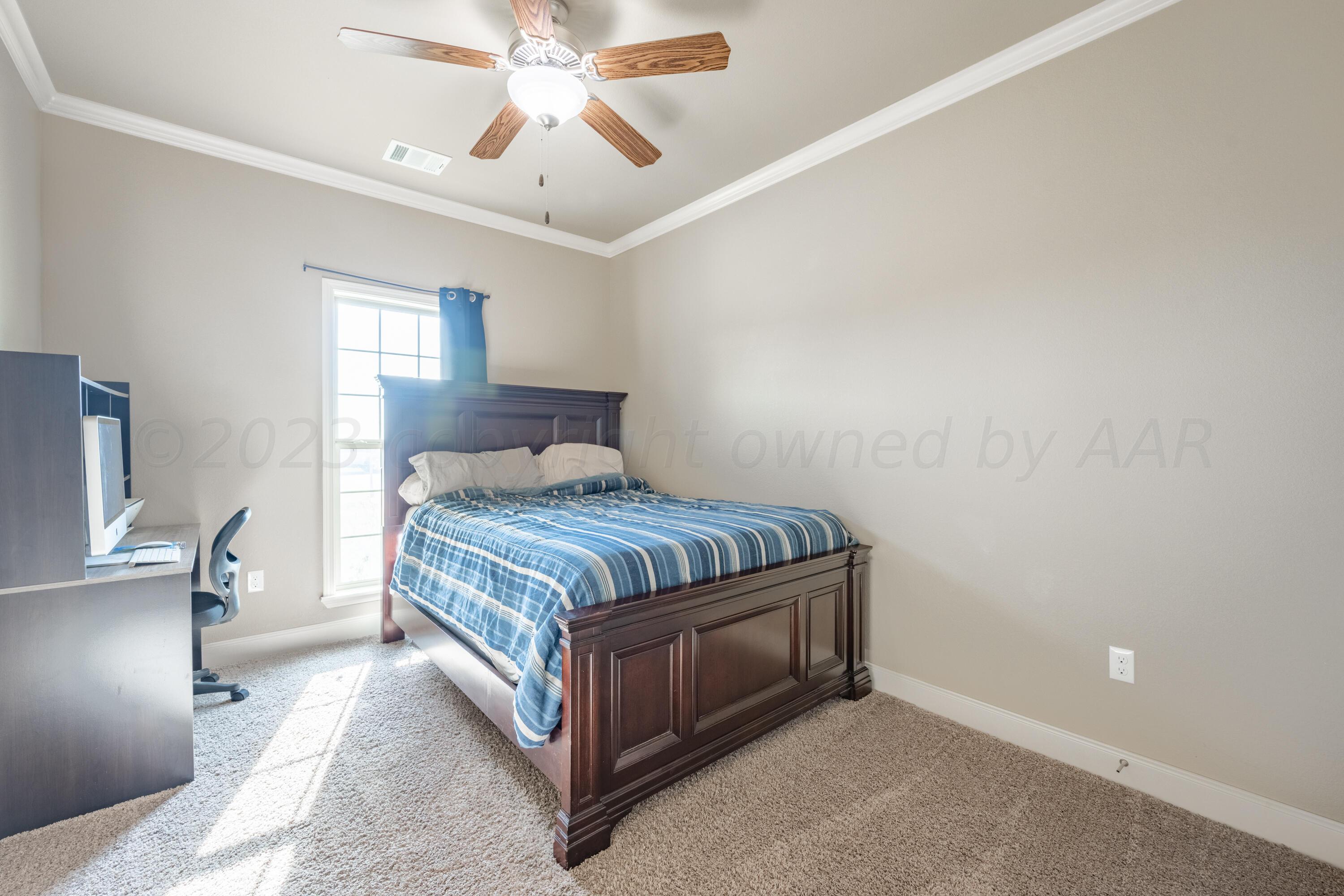 4910 Hicks Street Amarillo, TX 79118 - Photo 14 of 19 a bedroom with a bed and window