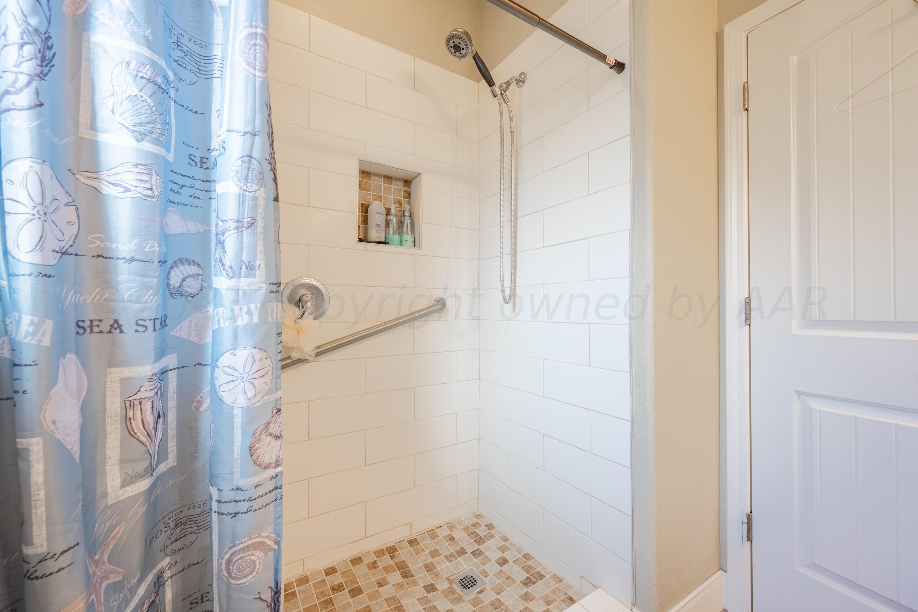 4910 Hicks Street Amarillo, TX 79118 - Photo 17 of 19 a bathroom with a shower