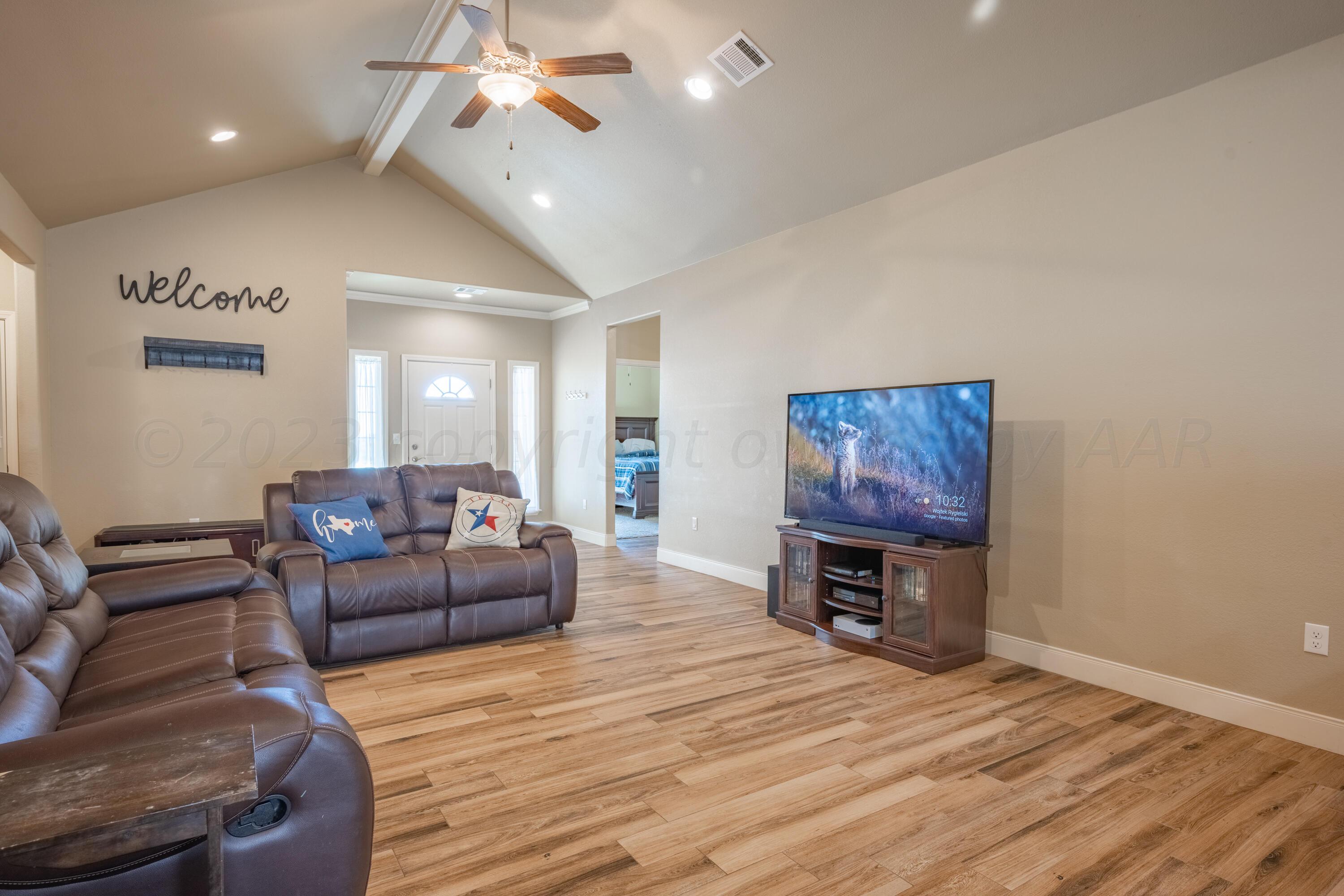 4910 Hicks Street Amarillo, TX 79118 - Photo 4 of 19 a living room with furniture and a wooden floor