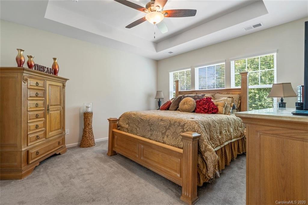 4303 Perth Road Indian Land, SC 29707 - Photo 23 of 32 a bedroom with a bed and a dresser