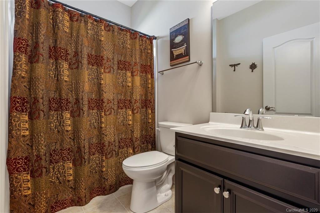 4303 Perth Road Indian Land, SC 29707 - Photo 27 of 32 a bathroom with a granite countertop sink toilet and shower