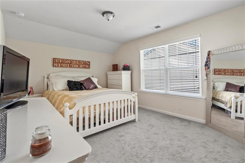 4303 Perth Road Indian Land, SC 29707 - Photo 28 of 32 a bedroom with a bed and a flat screen tv