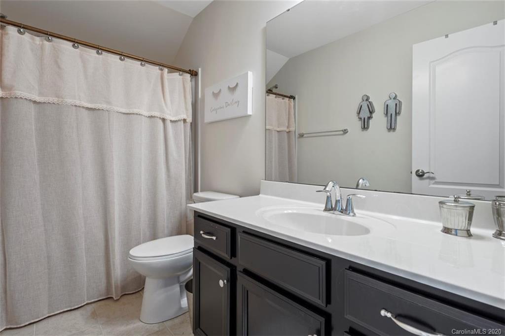 4303 Perth Road Indian Land, SC 29707 - Photo 29 of 32 a bathroom with a sink a toilet and a mirror