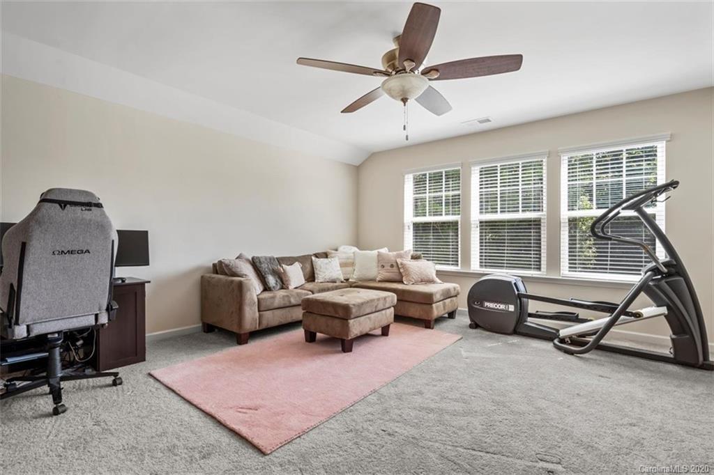 4303 Perth Road Indian Land, SC 29707 - Photo 30 of 32 a living room with furniture gym equipment and a window