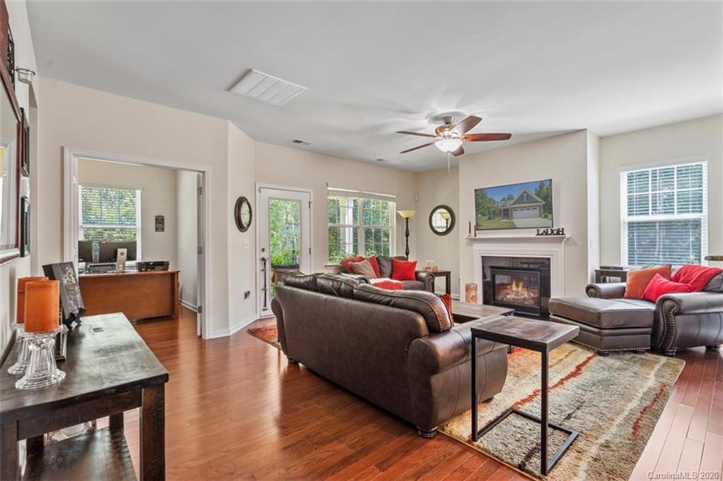 4303 Perth Road Indian Land, SC 29707 - Photo 8 of 32 a living room with furniture a fireplace and a table