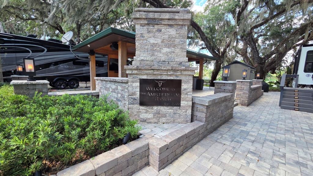 291 Bear Trail River Ranch, FL 33867 - Photo 1 of 23 a front view of a house with garden and trees