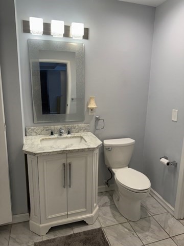 1 Seal Harbor Road, Unit 210 Winthrop, MA 02152 - Photo 14 of 27 a bathroom with a toilet sink and mirror