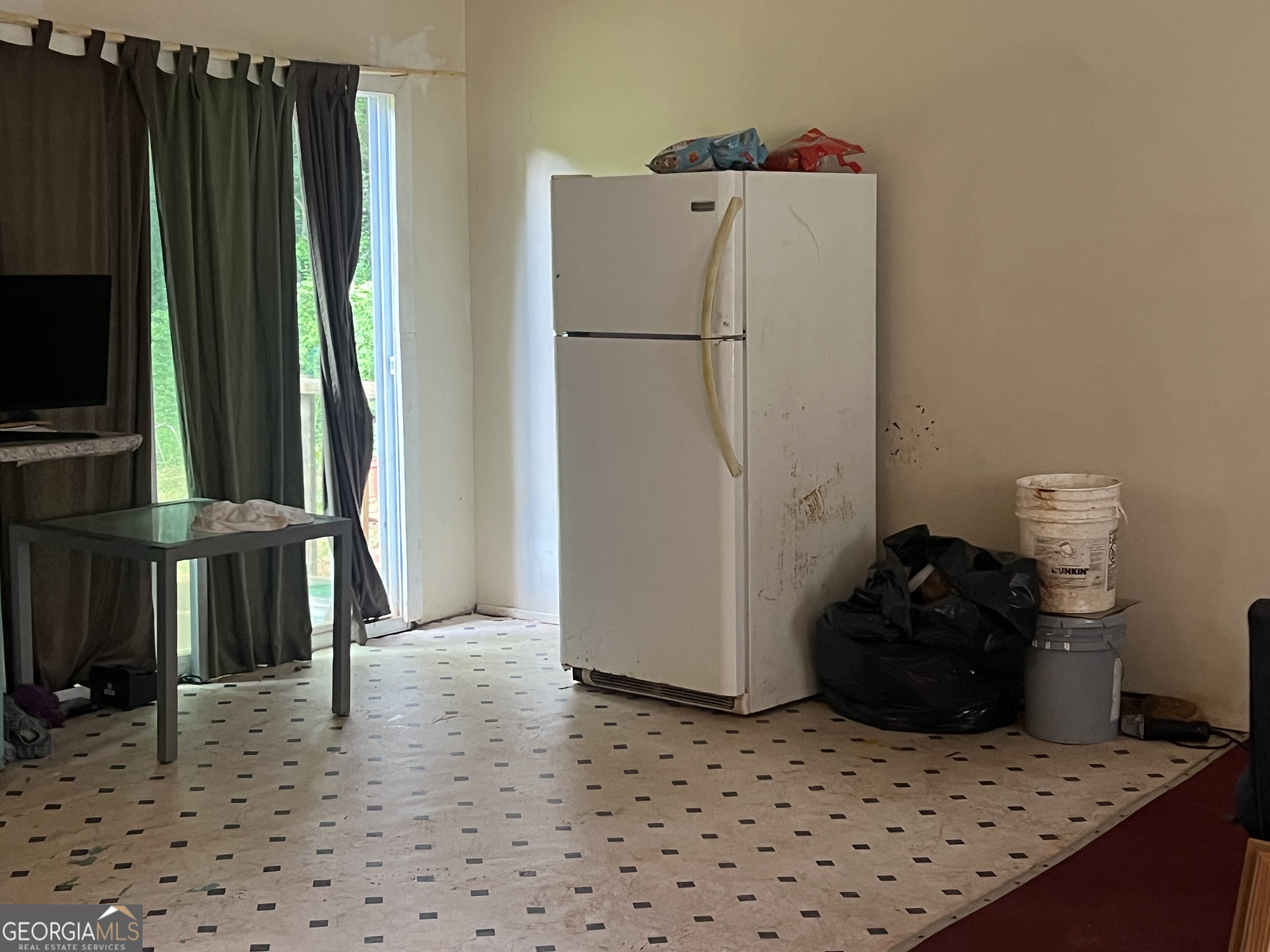 318 North Street Thomaston, GA 30286 - Photo 2 of 9 a white refrigerator freezer sitting inside of a kitchen