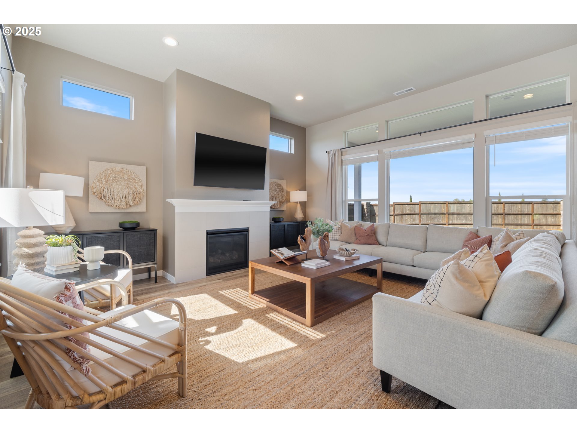 5567 North 94th Avenue, Unit LT247 Camas, WA 98607 - Photo 13 of 35 a living room with furniture a flat screen tv and a fireplace