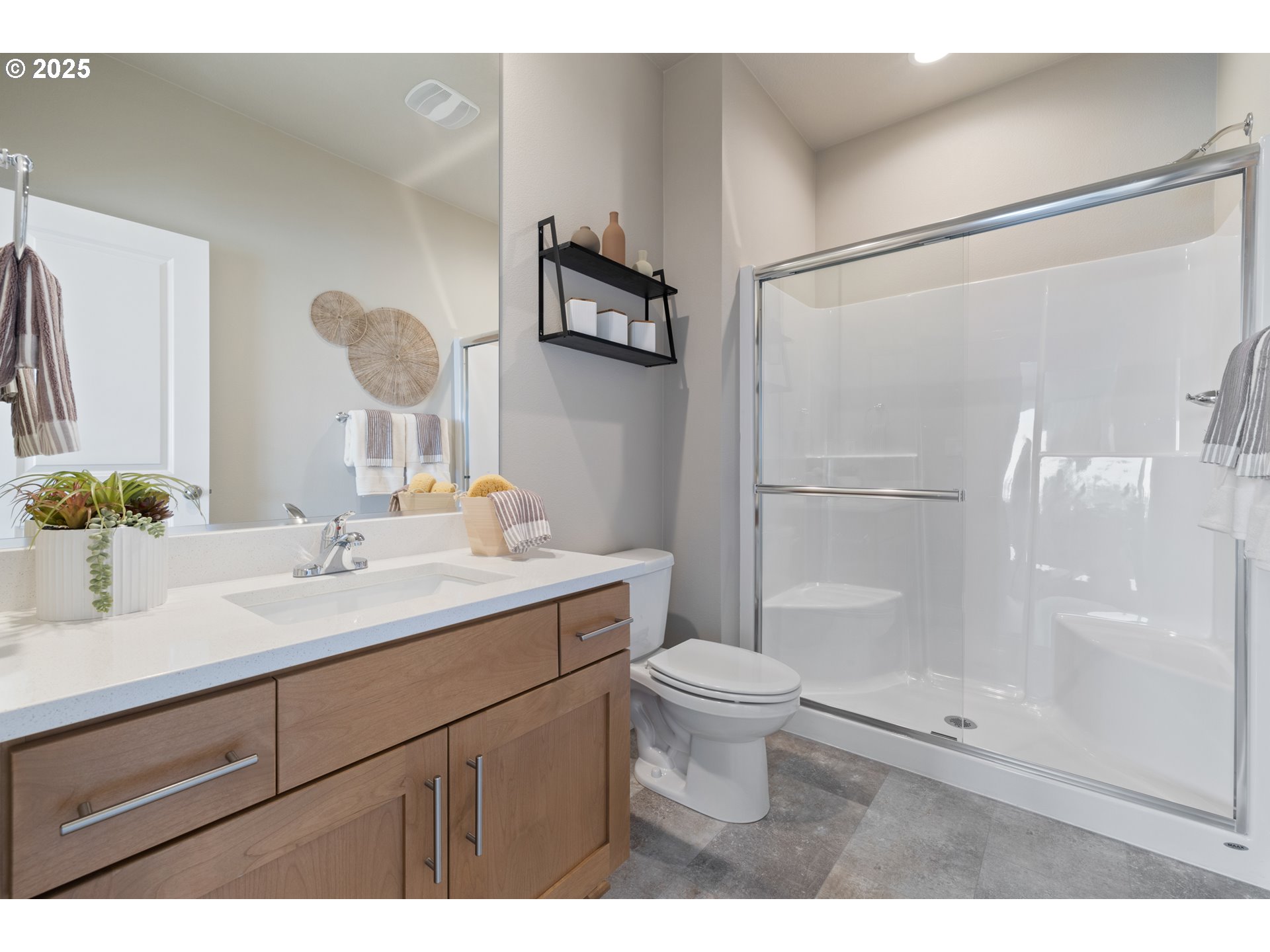 5567 North 94th Avenue, Unit LT247 Camas, WA 98607 - Photo 22 of 35 a bathroom with a sink a toilet and shower