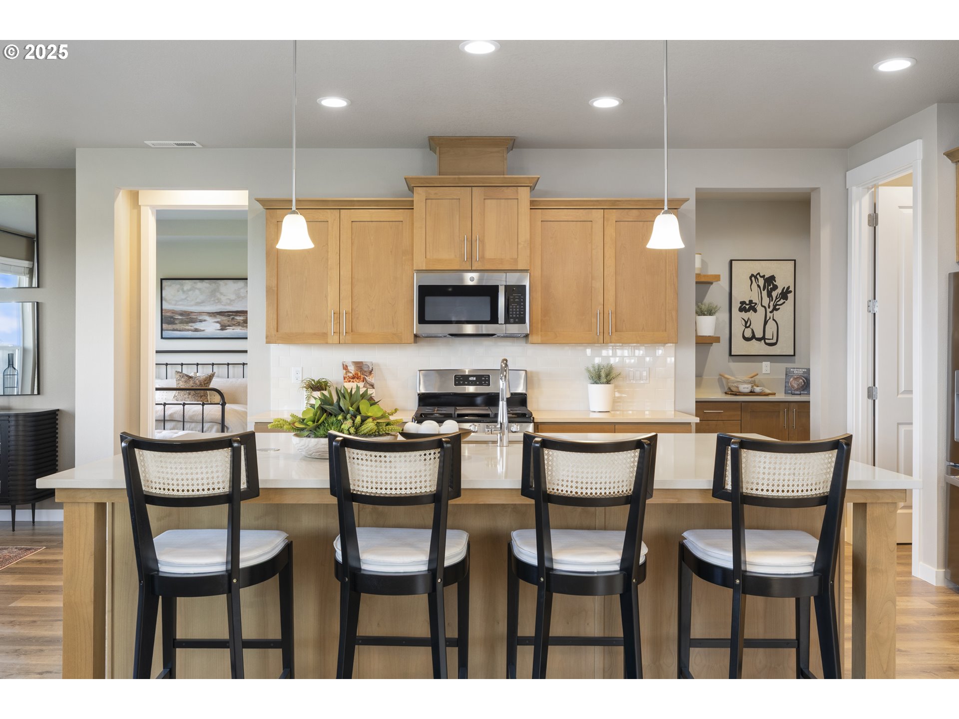 5567 North 94th Avenue, Unit LT247 Camas, WA 98607 - Photo 26 of 35 a kitchen with kitchen island granite countertop furniture and a view of living room