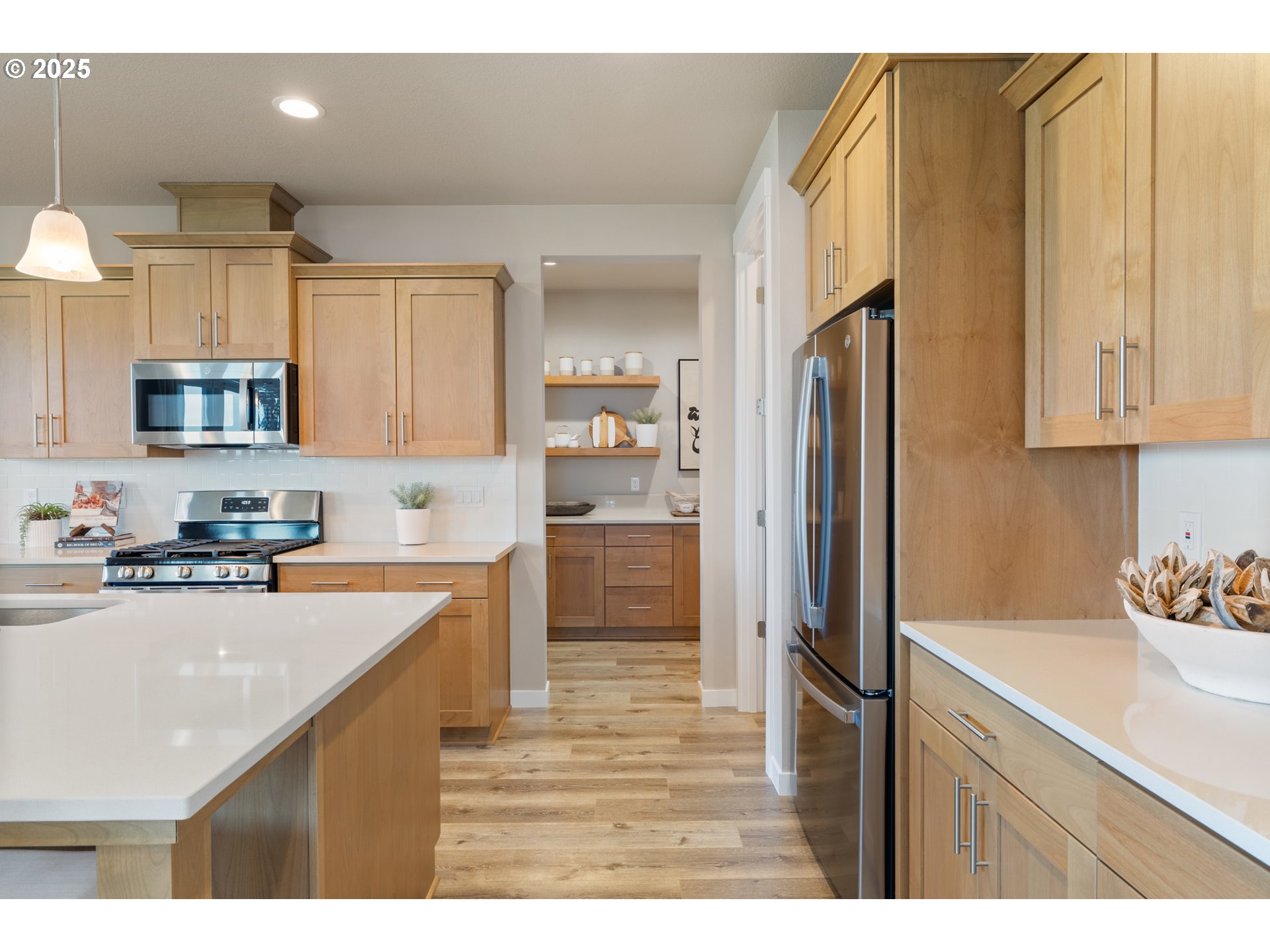 5567 North 94th Avenue, Unit LT247 Camas, WA 98607 - Photo 28 of 35 a kitchen with stainless steel appliances granite countertop a refrigerator sink and cabinets