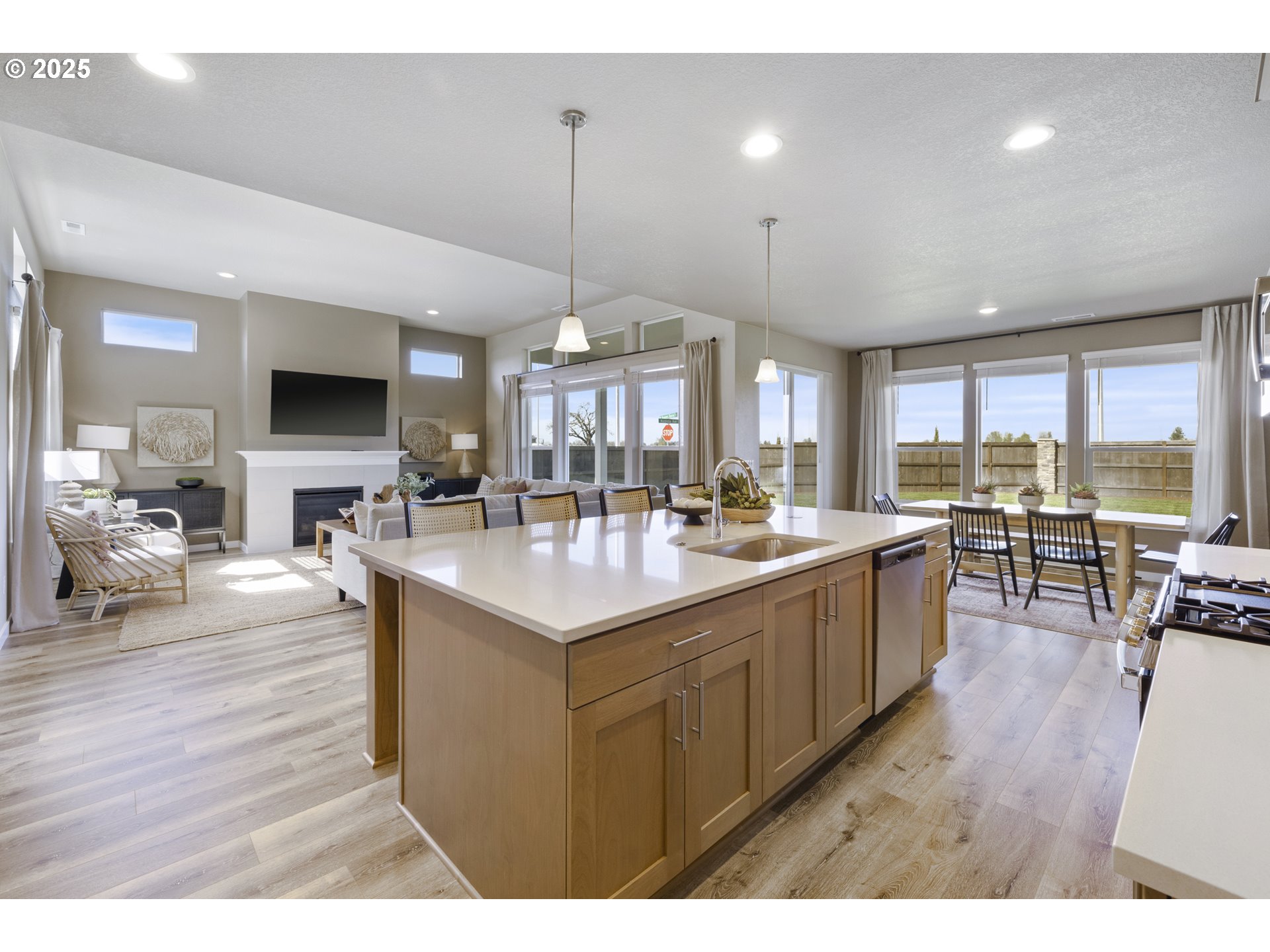 5567 North 94th Avenue, Unit LT247 Camas, WA 98607 - Photo 30 of 35 a large kitchen with a counter space a sink appliances and a dining table
