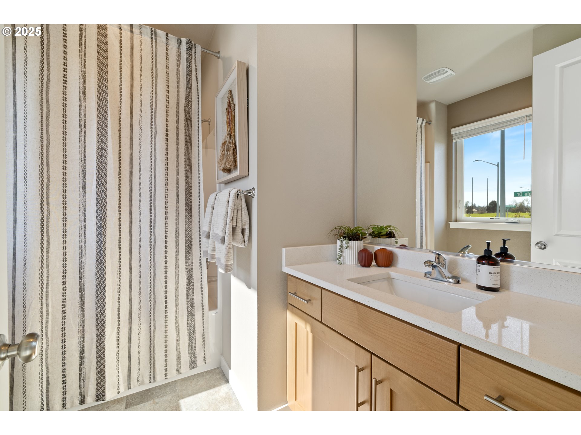 5567 North 94th Avenue, Unit LT247 Camas, WA 98607 - Photo 4 of 35 a bathroom with a sink a mirror and a shower