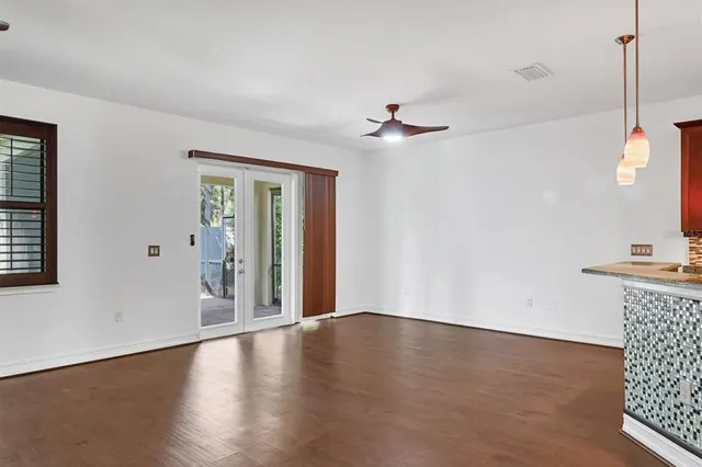a view of a livingroom with wooden floor