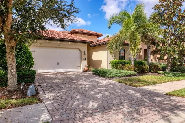 a front view of house with yard and trees