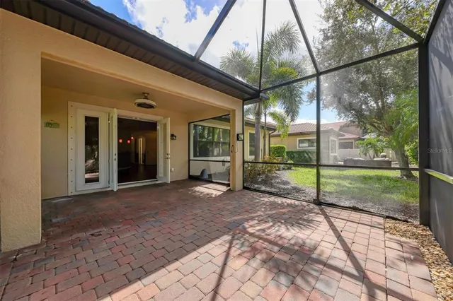 a view of a house with backyard and porch