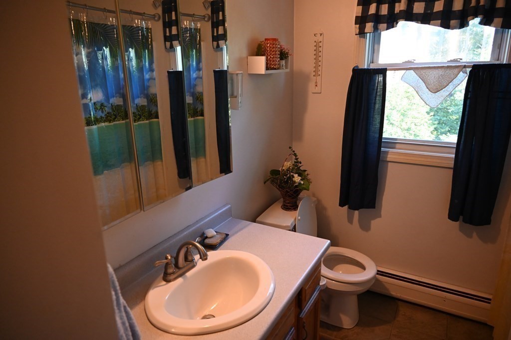 6 Shawnee Road Worcester, MA 01606 - Photo 11 of 39 a bathroom with a toilet sink and mirror