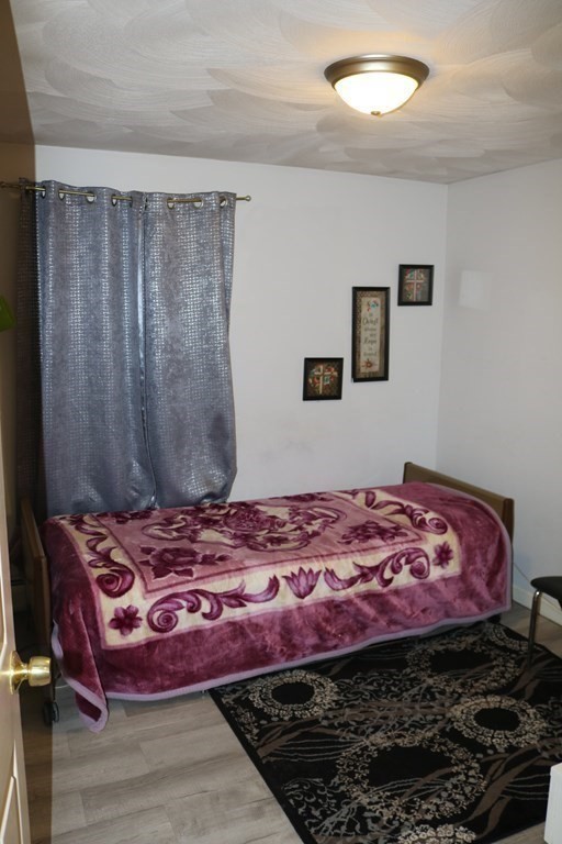 6 Shawnee Road Worcester, MA 01606 - Photo 19 of 39 a bedroom with a bed and a dresser
