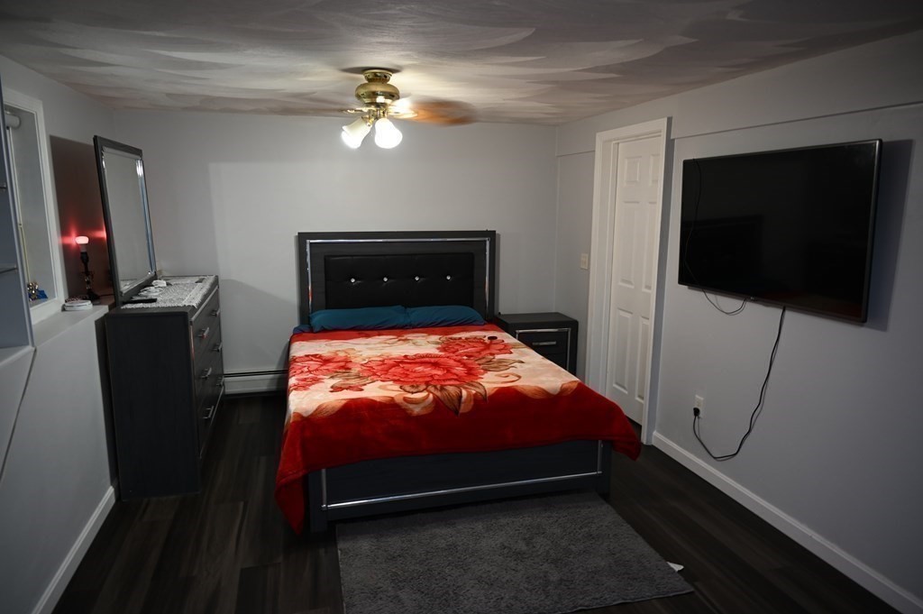 6 Shawnee Road Worcester, MA 01606 - Photo 26 of 39 a bed sitting in a bedroom next to a window