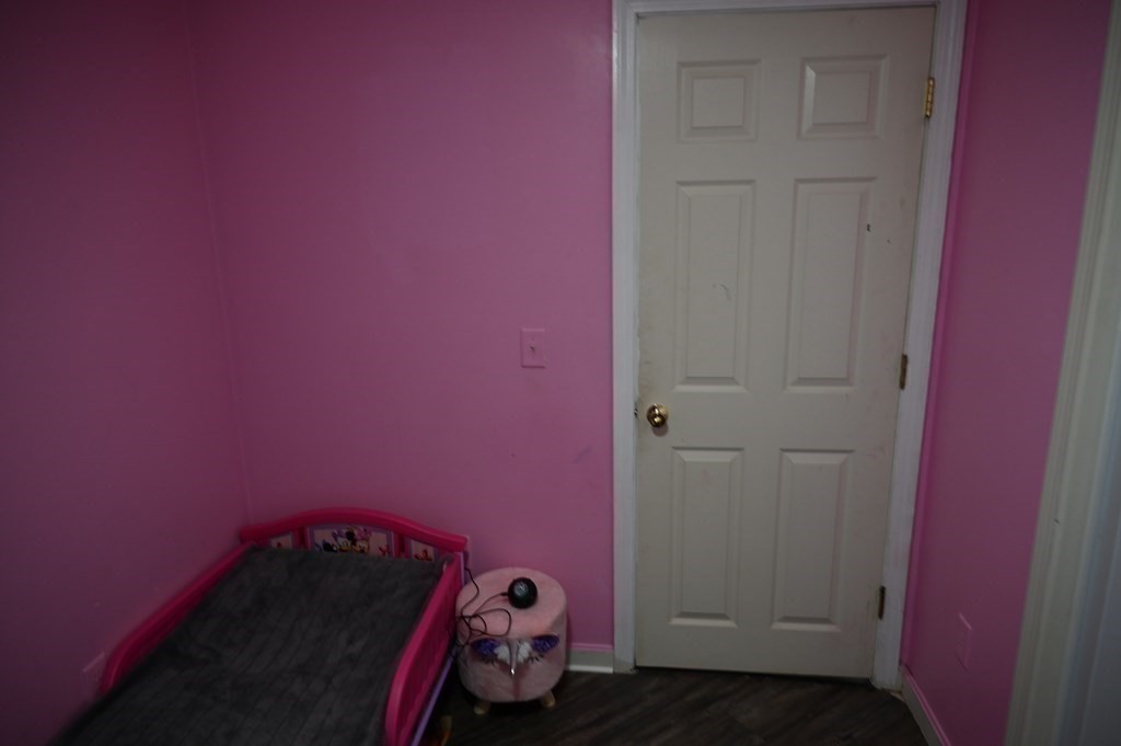 6 Shawnee Road Worcester, MA 01606 - Photo 29 of 39 a bedroom with a bed and a dresser in it
