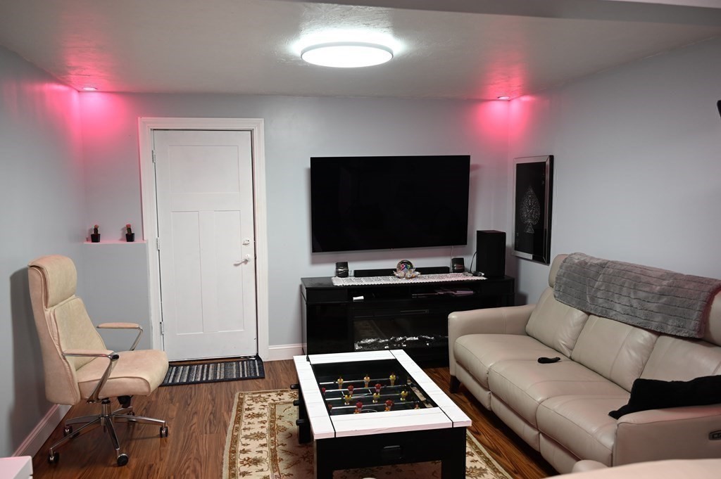 6 Shawnee Road Worcester, MA 01606 - Photo 30 of 39 a living room with furniture and a flat screen tv