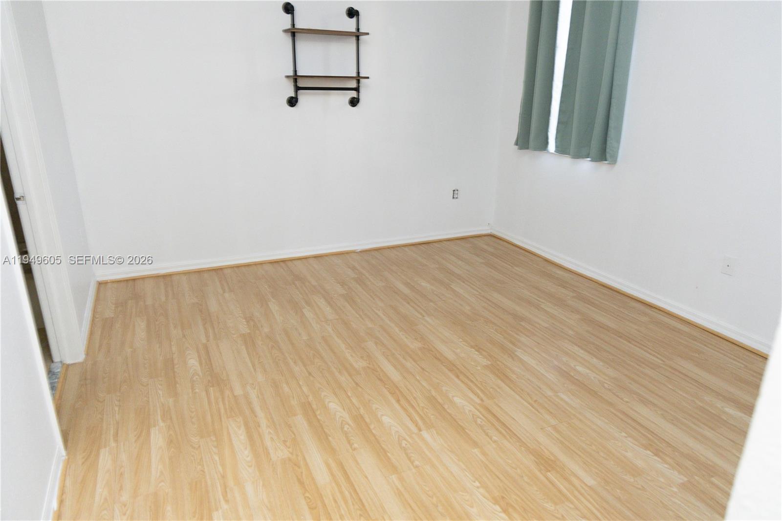 761 Southeast 2nd Street Homestead, FL 33030 - Photo 11 of 17 a view of a room with wooden floor
