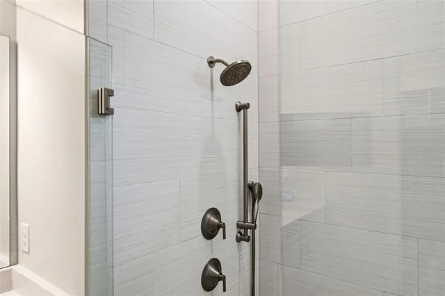 a patio with table and chairs and potted plants