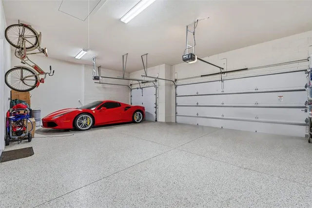 a bedroom with a bed and a view of kitchen