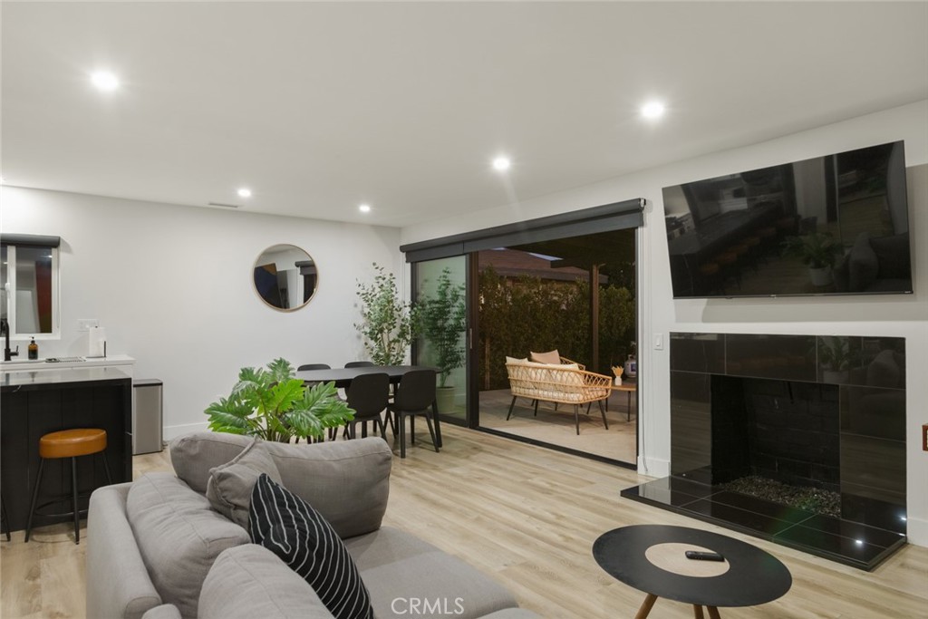 4555 Oakdale Street Montclair, CA 91763 - Photo 1 of 39 a living room with furniture a flat screen tv and a fireplace