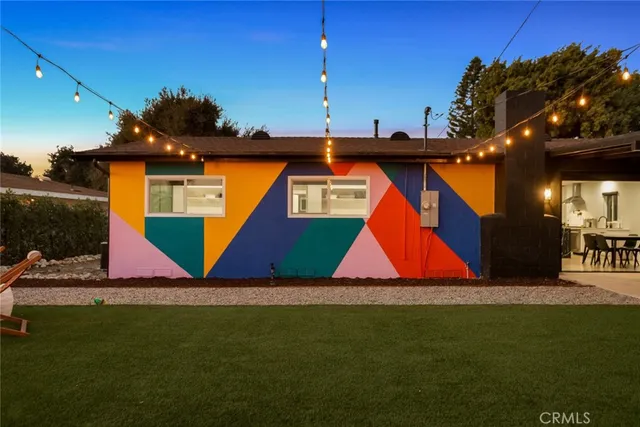a view of swimming pool with a table and chairs