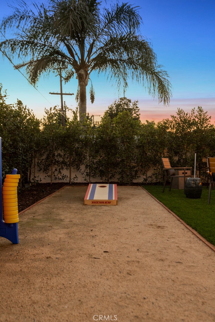 4555 Oakdale Street Montclair, CA 91763 - Photo 13 of 39 a view of swimming pool with a table and chairs