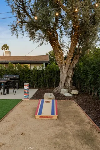 a view of a street with potted plants