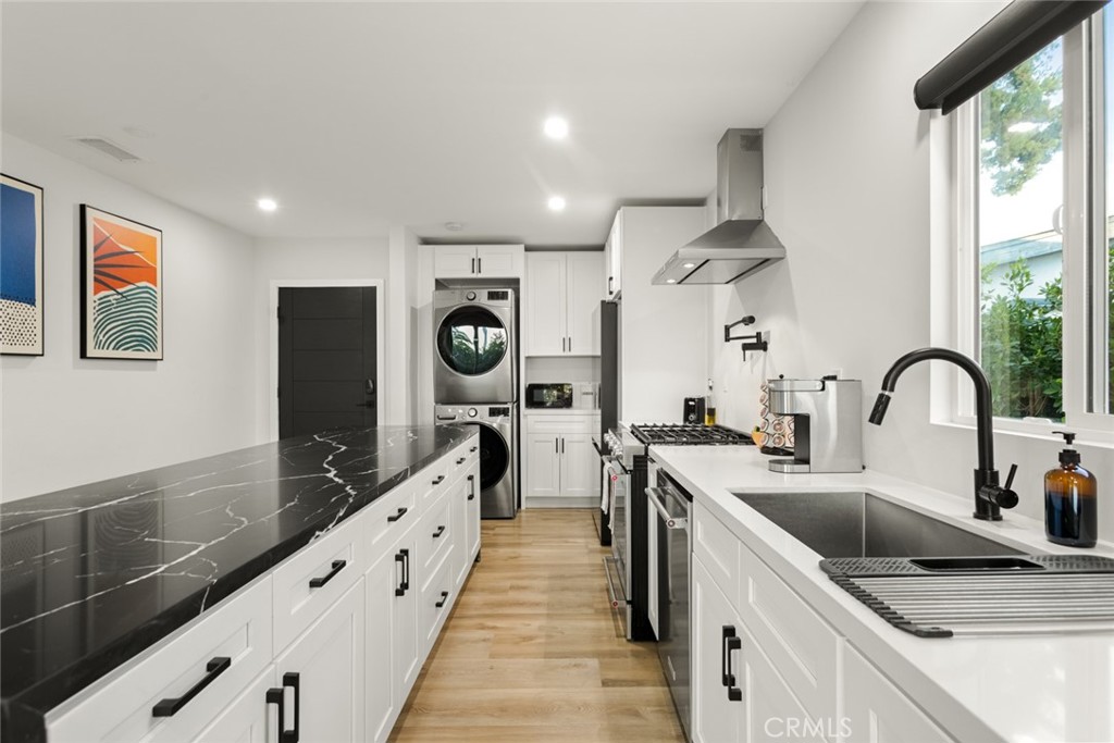 4555 Oakdale Street Montclair, CA 91763 - Photo 25 of 39 a kitchen with stainless steel appliances granite countertop a sink and a stove