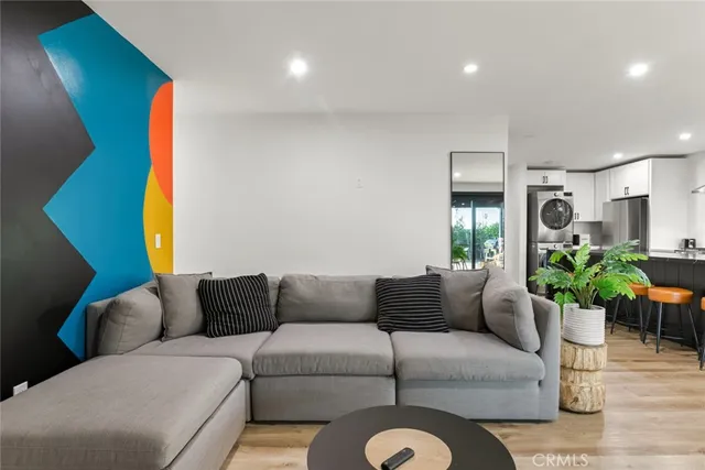 a living room with furniture and a potted plant