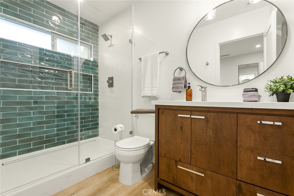 4555 Oakdale Street Montclair, CA 91763 - Photo 34 of 39 a bathroom with a sink a toilet and shower