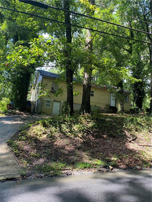 2325 Butner Road Atlanta, GA 30331 - Photo 1 of 1 a backyard of a house with lots of green space
