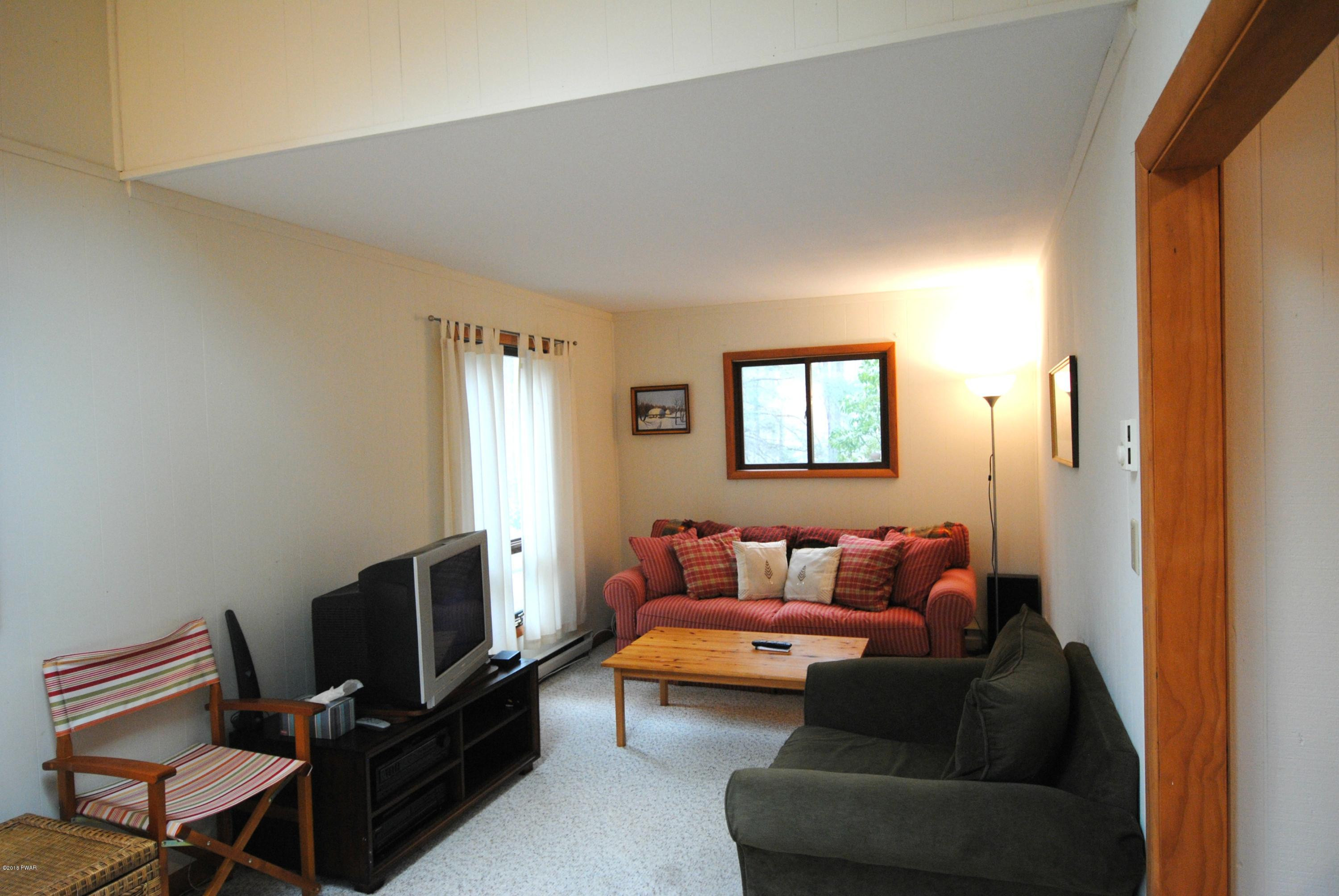 3036 Northgate Road Lake Ariel, PA 18436 - Photo 12 of 26 a living room with furniture and a flat screen tv