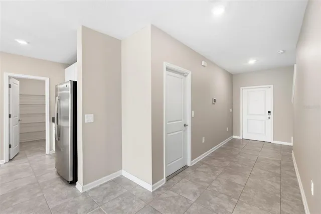 a view of entryway with kitchen